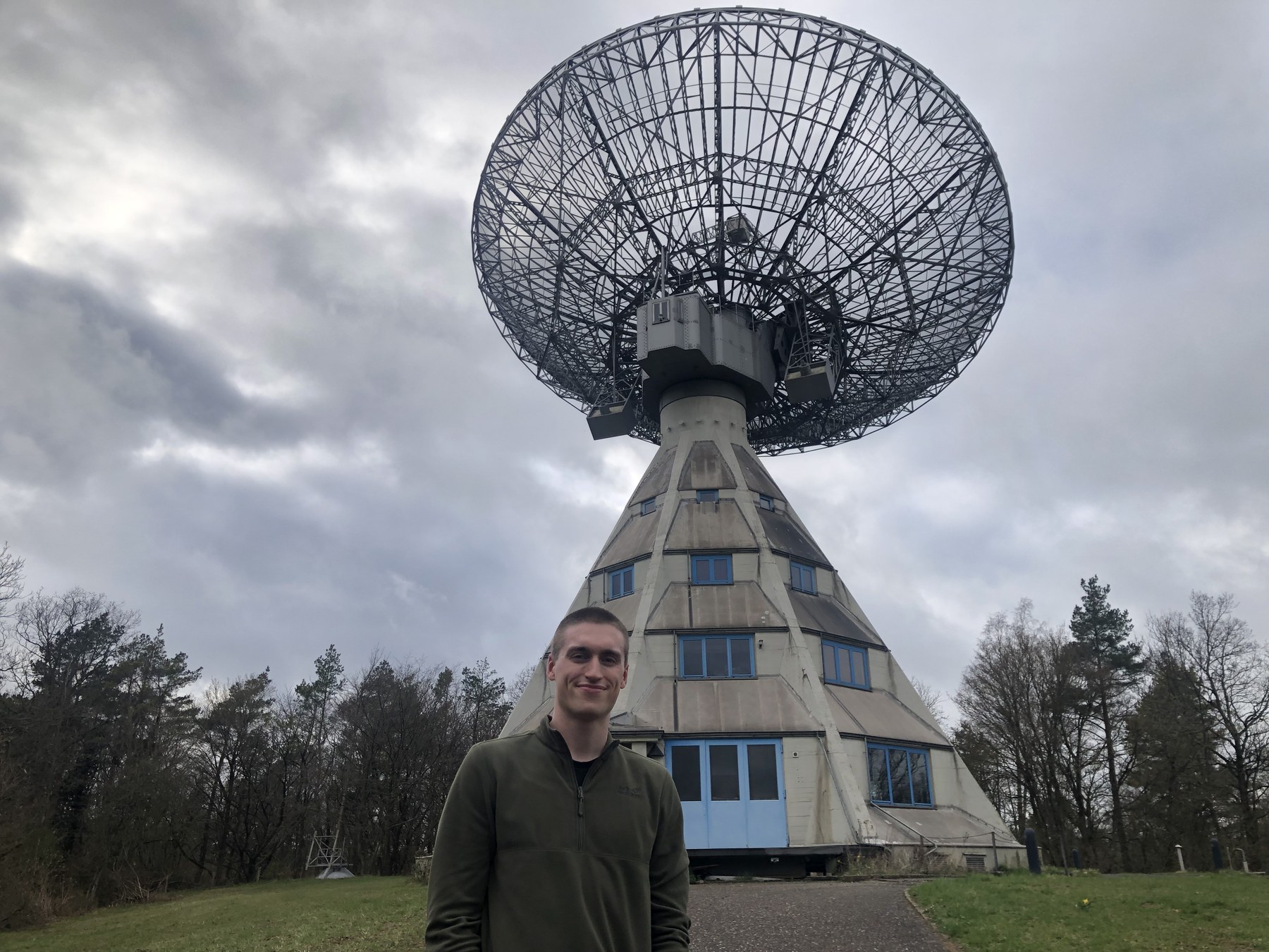 Jacob Cardinal Tremblay standing in front of the Stockert radio telescope