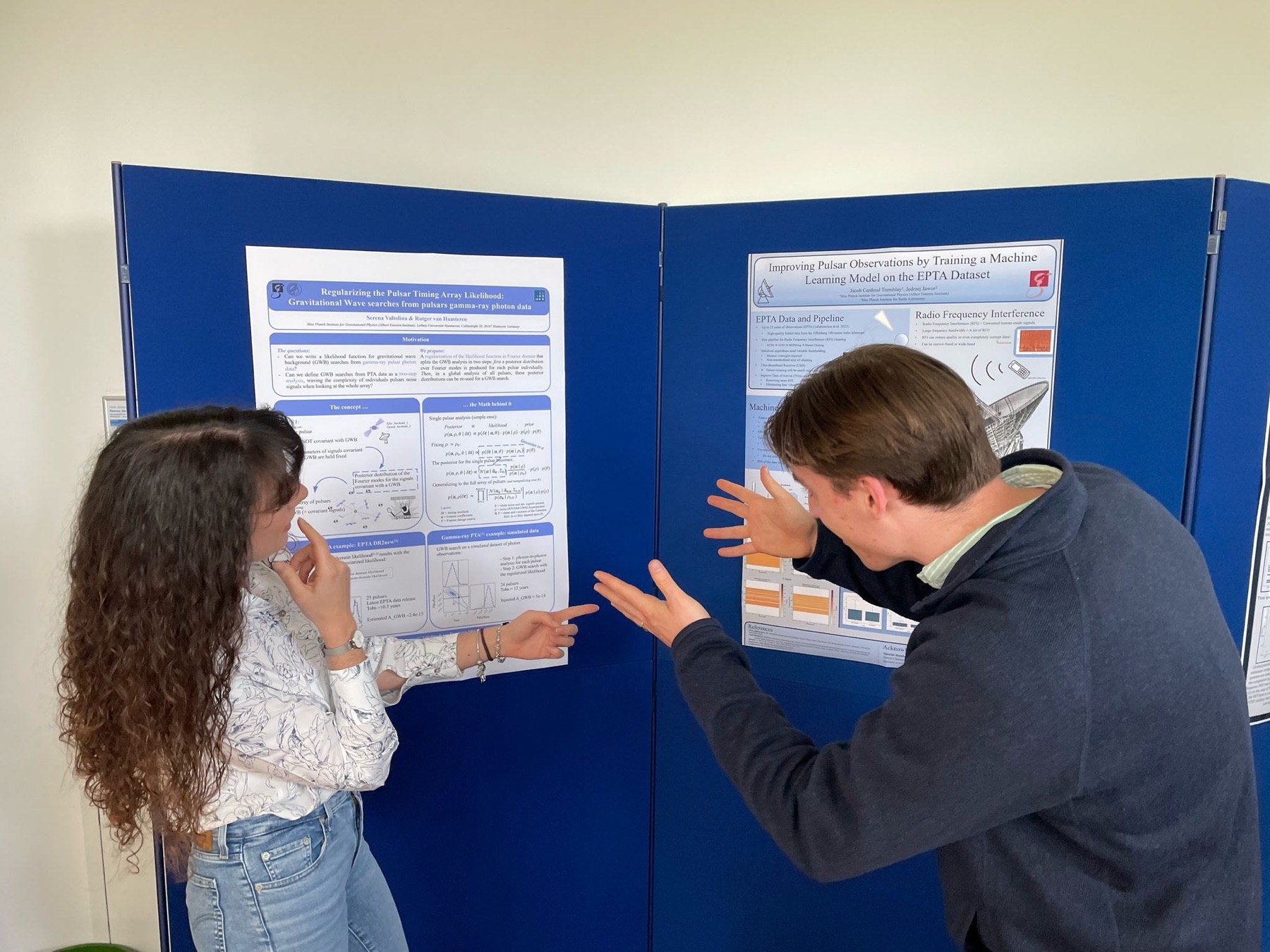 Jacob Cardinal Tremblay and Serena Valtolina discussing a machine-learning RFI poster