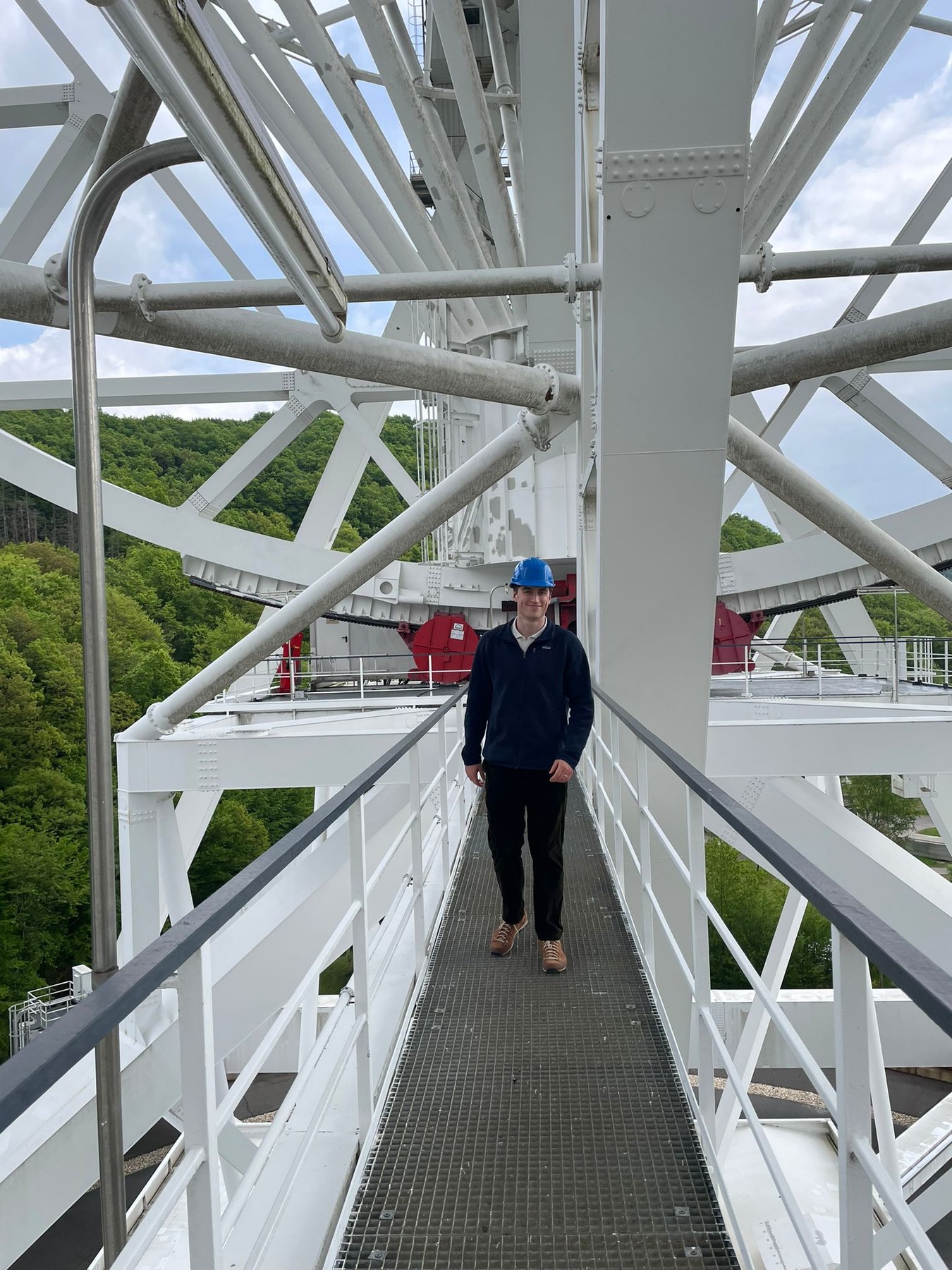 Jacob Cardinal Tremblay walking along the structure of the Effelsberg radio telescope
